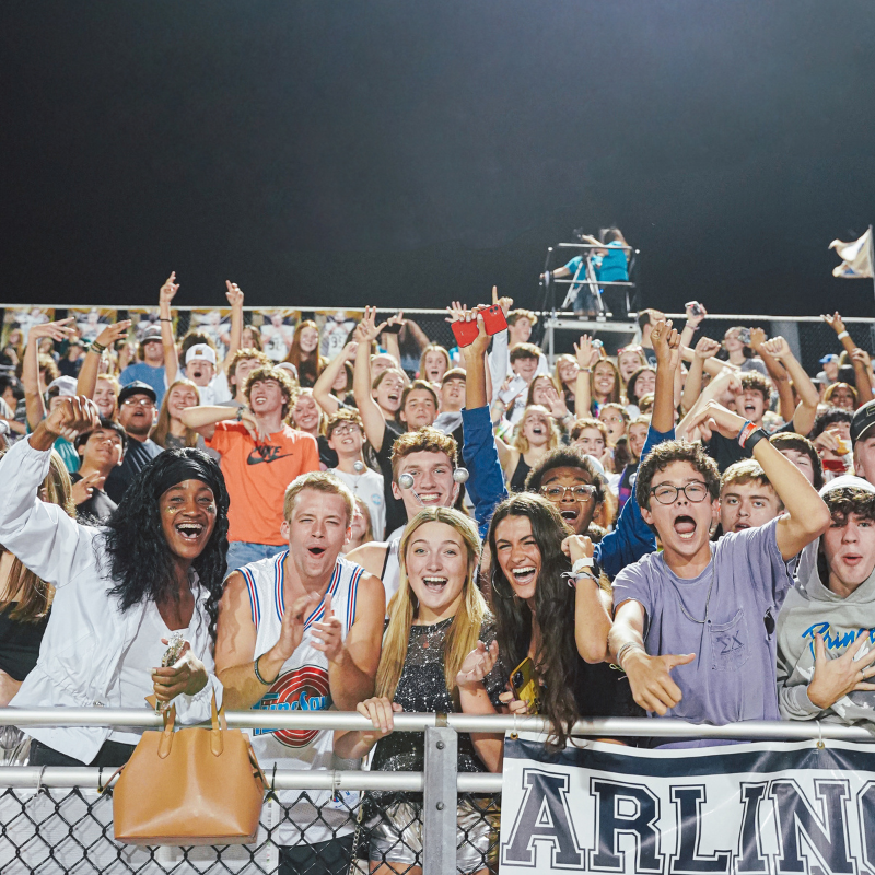 picture of teenagers cheering at football game
